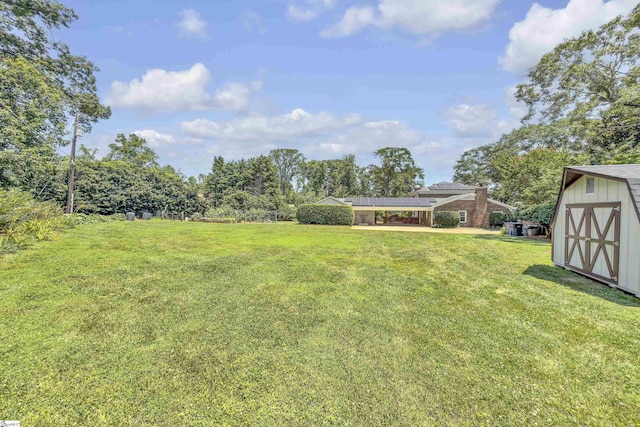 1 Redcliffe Rd, Greenville, SC 29615 - view of green lawn featuring a shed and a detached carport