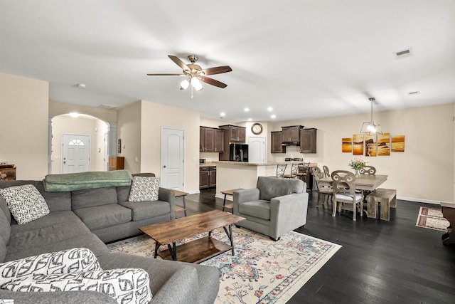 144 Caledonia Dr, Easley, SC 29642 - living area featuring arched walkways, ceiling fan, recessed lighting, dark wood-style floors, and ornate columns