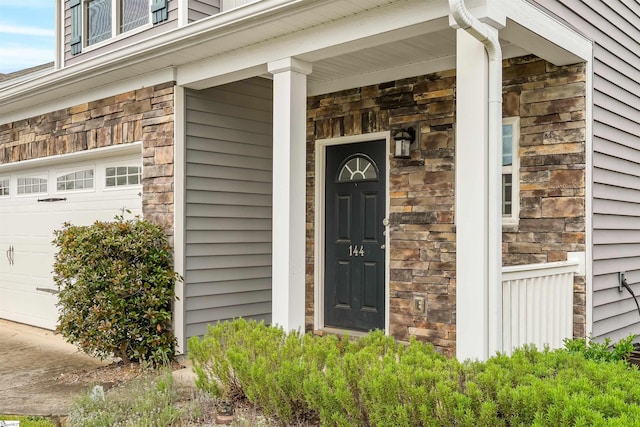 144 Caledonia Dr, Easley, SC 29642 - entrance to property featuring an attached garage and stone siding