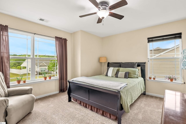 144 Caledonia Dr, Easley, SC 29642 - bedroom with light carpet, multiple windows, and ceiling fan