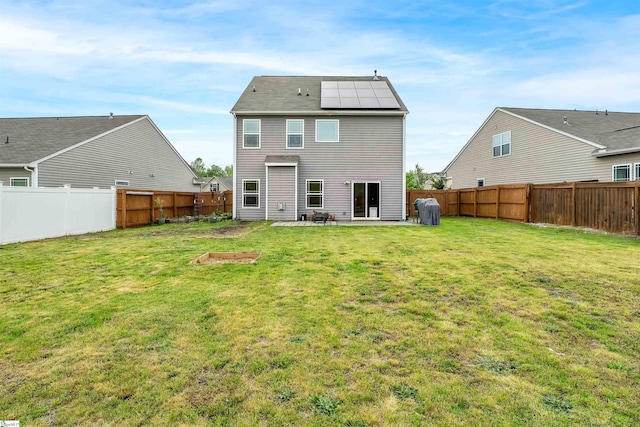 144 Caledonia Dr, Easley, SC 29642 - rear view of house featuring solar panels, a fenced backyard, and a patio