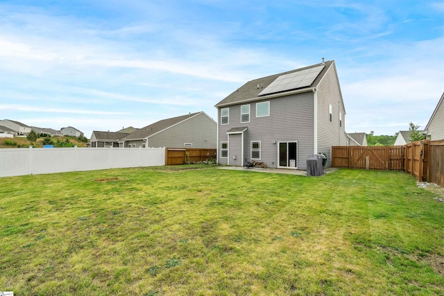 144 Caledonia Dr, Easley, SC 29642 - back of house with solar panels, a patio, and a fenced backyard