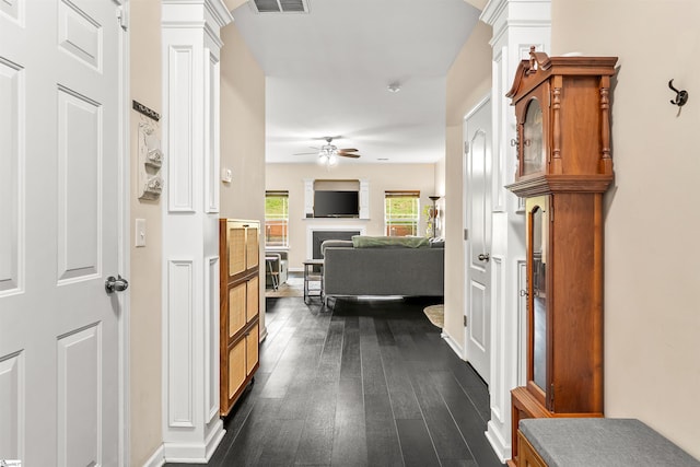 144 Caledonia Dr, Easley, SC 29642 - hallway featuring dark wood-style flooring and ornate columns