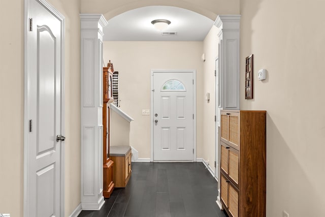 144 Caledonia Dr, Easley, SC 29642 - doorway with arched walkways, dark wood-style flooring, and ornate columns