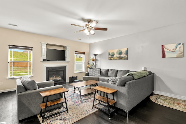 144 Caledonia Dr, Easley, SC 29642 - living room featuring a ceiling fan, dark wood-style flooring, and a fireplace with flush hearth