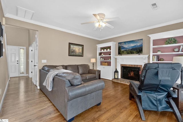 3 Promontory Ct, Greenville, SC 29615 - living room with ceiling fan, light wood-type flooring, ornamental molding, and a brick fireplace