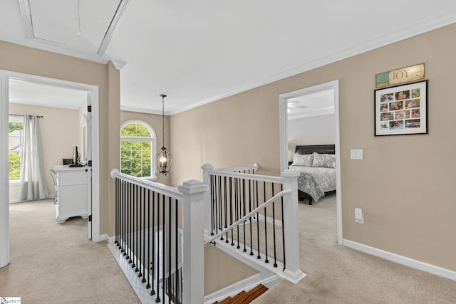 3 Promontory Ct, Greenville, SC 29615 - hall with attic access, carpet flooring, an upstairs landing, and crown molding