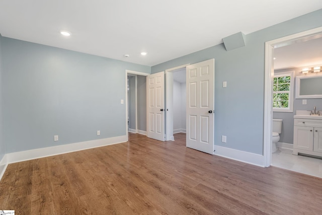 17 Allen St, Enoree, SC 29335 - unfurnished bedroom featuring light wood-style floors, recessed lighting, connected bathroom, and a spacious closet