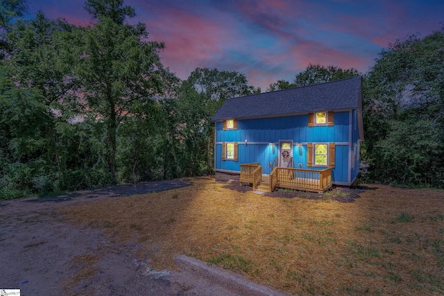 17 Allen St, Enoree, SC 29335 - view of front of home with a wooden deck, roof with shingles, board and batten siding, and a front lawn