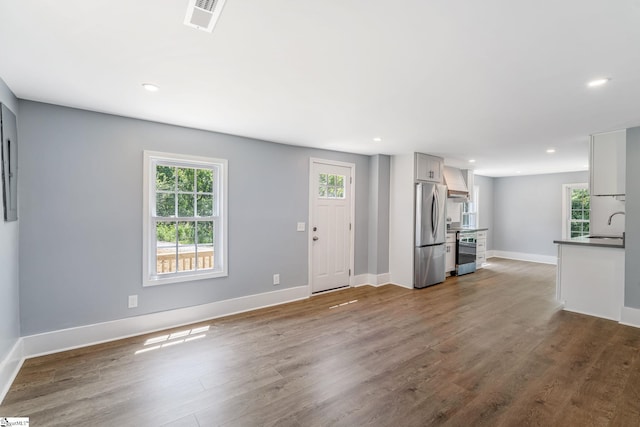 17 Allen St, Enoree, SC 29335 - unfurnished living room featuring dark wood-style floors and recessed lighting