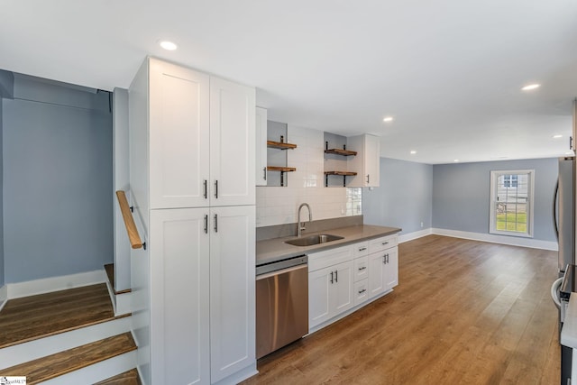 17 Allen St, Enoree, SC 29335 - kitchen with dishwasher, tasteful backsplash, white cabinets, open shelves, and light wood finished floors