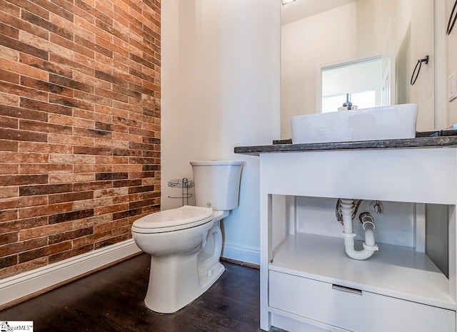 607 Greening Dr, Simpsonville, SC 29681 - bathroom featuring wood finished floors and brick wall