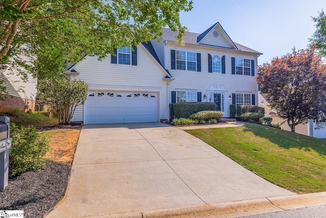 607 Greening Dr, Simpsonville, SC 29681 - colonial home with concrete driveway, a front yard, and a garage