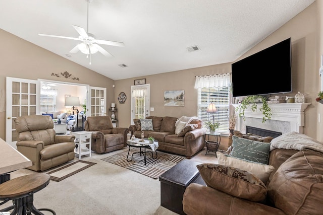 243 Rivers Edge Dr, Easley, SC 29642 - living area with vaulted ceiling, carpet flooring, a ceiling fan, and a premium fireplace