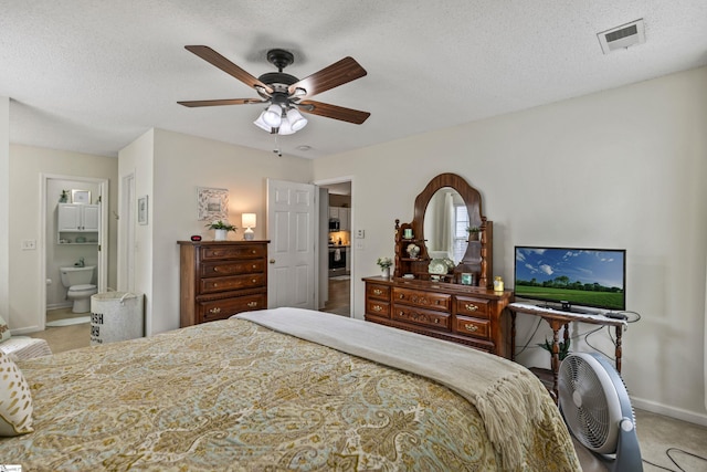 243 Rivers Edge Dr, Easley, SC 29642 - bedroom with ensuite bath, ceiling fan, and a textured ceiling