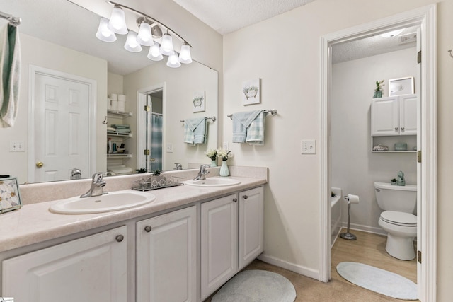 243 Rivers Edge Dr, Easley, SC 29642 - bathroom with double vanity, a shower, a textured ceiling, and a bathtub