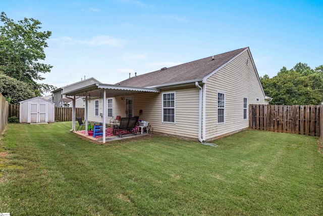 243 Rivers Edge Dr, Easley, SC 29642 - back of house with a patio area, a storage unit, a fenced backyard, and roof with shingles