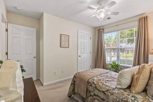 243 Rivers Edge Dr, Easley, SC 29642 - bedroom with light carpet, a textured ceiling, and a ceiling fan