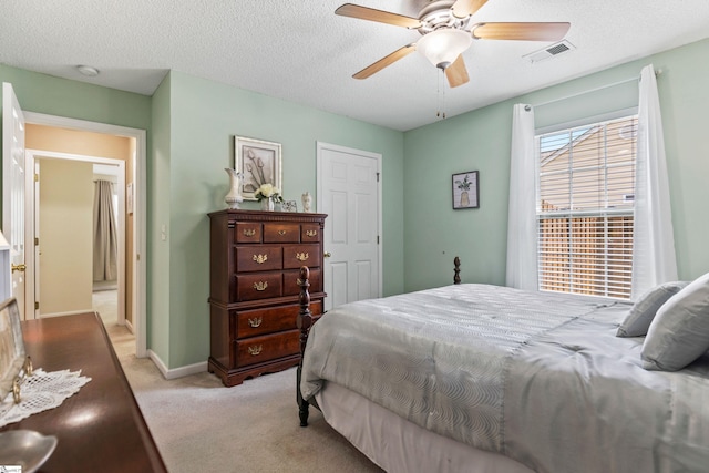 243 Rivers Edge Dr, Easley, SC 29642 - bedroom featuring light carpet, a textured ceiling, and a ceiling fan