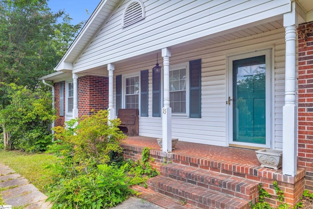 15 Jones Ave, Greenville, SC 29601 - view of exterior entry with covered porch and brick siding