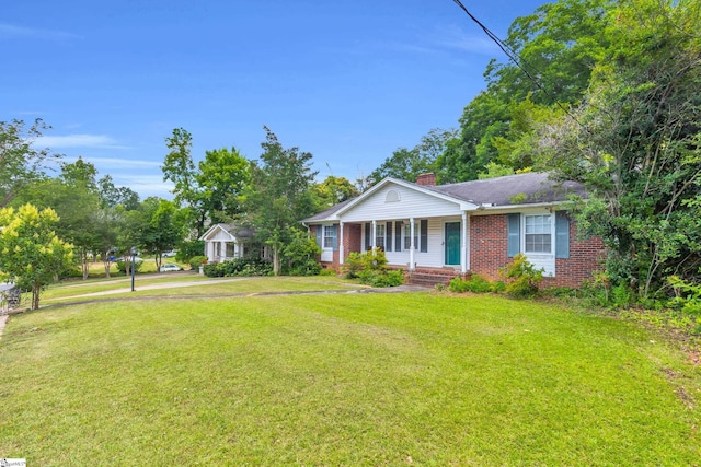 15 Jones Ave, Greenville, SC 29601 - ranch-style house with brick siding, a chimney, covered porch, and a front yard