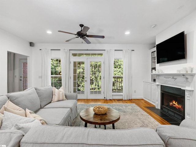 170 Shirleys Farm Rd, Seneca, SC 29678 - living room with plenty of natural light, a fireplace with flush hearth, a ceiling fan, recessed lighting, and light wood-type flooring