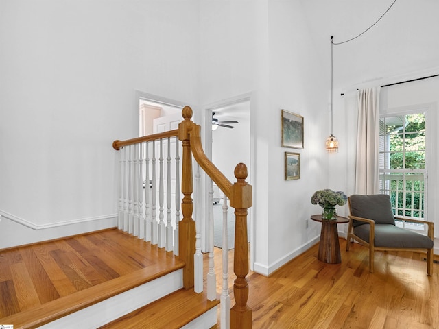 170 Shirleys Farm Rd, Seneca, SC 29678 - stairs featuring wood finished floors, a ceiling fan, and a high ceiling