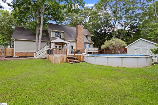 105 Fox Chase Ct, Simpsonville, SC 29680 - rear view of house with a gazebo, a deck, stairway, a chimney, and an outdoor pool
