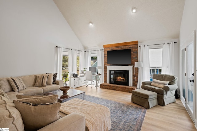 105 Fox Chase Ct, Simpsonville, SC 29680 - living area featuring a fireplace, light wood finished floors, and high vaulted ceiling
