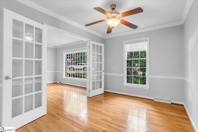 402 Rosebud Ct, Greer, SC 29650 - spare room with hardwood / wood-style floors, french doors, a ceiling fan, and crown molding