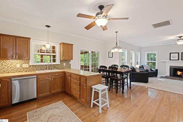 629 Germander Ct, Greer, SC 29651 - kitchen with stainless steel dishwasher, a ceiling fan, light countertops, a peninsula, and ornamental molding