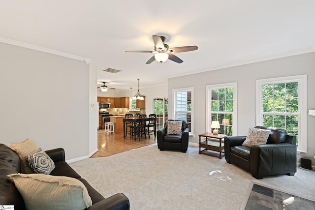 629 Germander Ct, Greer, SC 29651 - living area featuring ceiling fan, ornamental molding, light carpet, and a chandelier