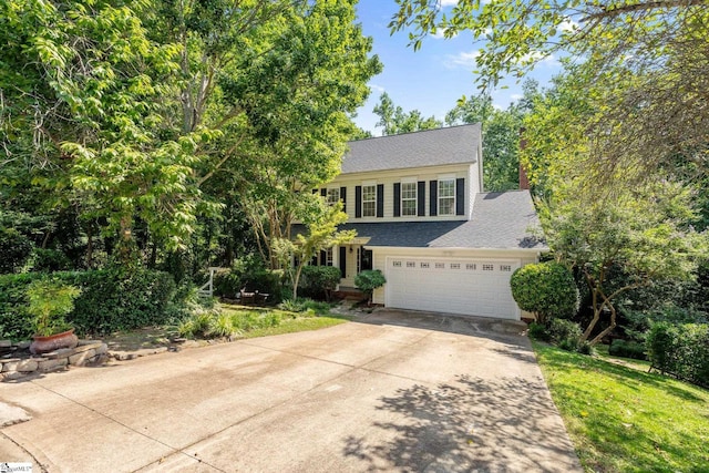 629 Germander Ct, Greer, SC 29651 - view of front facade with concrete driveway, a shingled roof, an attached garage, and a front lawn