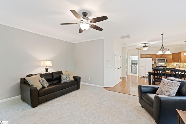 629 Germander Ct, Greer, SC 29651 - living room featuring a ceiling fan, light colored carpet, and crown molding