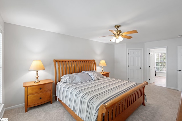 629 Germander Ct, Greer, SC 29651 - bedroom featuring light colored carpet, a ceiling fan, and connected bathroom