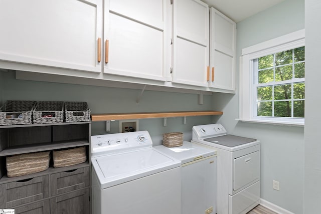 629 Germander Ct, Greer, SC 29651 - washroom with separate washer and dryer and cabinet space
