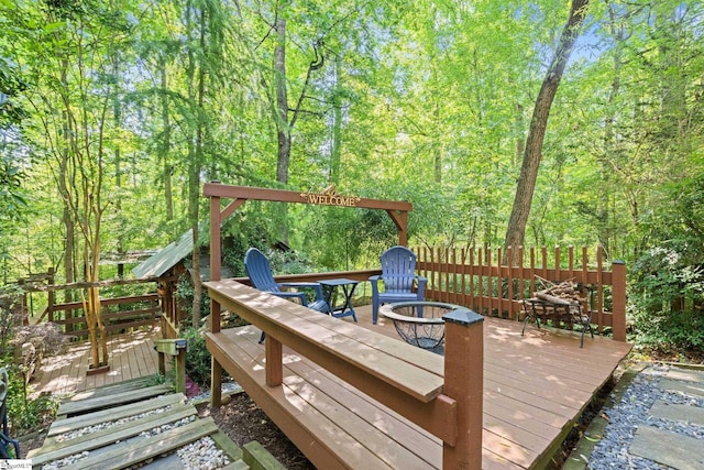 629 Germander Ct, Greer, SC 29651 - deck featuring an outdoor fire pit and a forest view