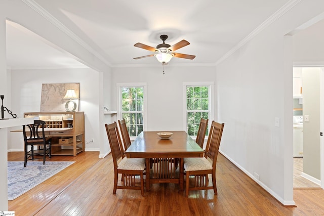 629 Germander Ct, Greer, SC 29651 - dining space featuring light wood-type flooring, ceiling fan, crown molding, and washer / dryer