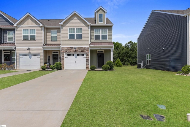 138 Rushing Creek Ln, Piedmont, SC 29673 - view of front of house featuring driveway, stone siding, a front yard, a standing seam roof, and a garage