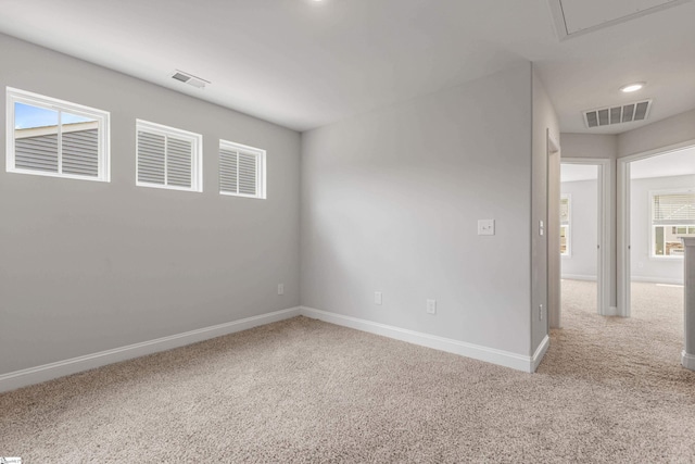 138 Rushing Creek Ln, Piedmont, SC 29673 - empty room featuring carpet floors, healthy amount of natural light, and attic access