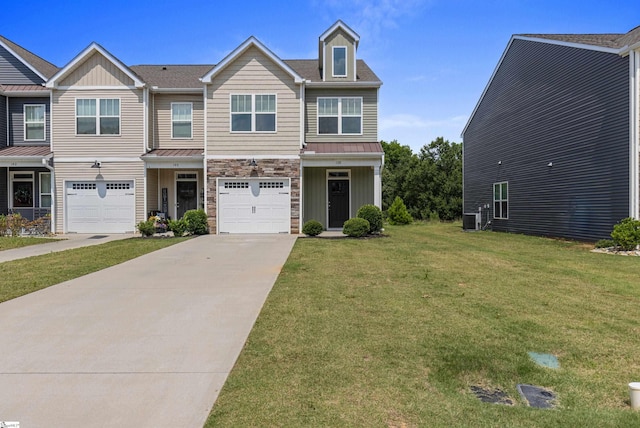 138 Rushing Creek Ln, Piedmont, SC 29673 - view of front facade featuring stone siding, concrete driveway, a front lawn, a garage, and board and batten siding