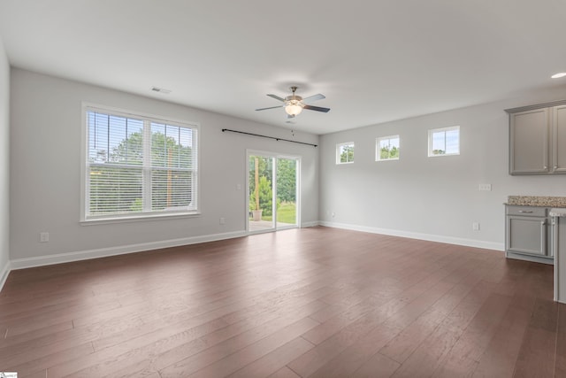138 Rushing Creek Ln, Piedmont, SC 29673 - unfurnished living room featuring ceiling fan, healthy amount of natural light, and dark wood-type flooring