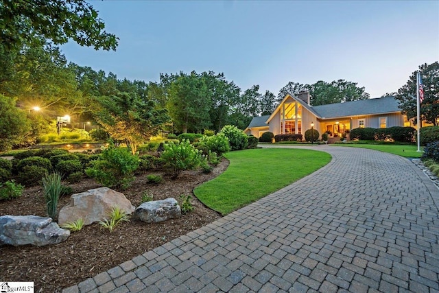 4 Huntington Ct, Greenville, SC 29615 - view of front facade featuring a front lawn, curved driveway, and a chimney