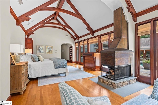 4 Huntington Ct, Greenville, SC 29615 - bedroom with arched walkways, access to outside, beam ceiling, high vaulted ceiling, and wood finished floors