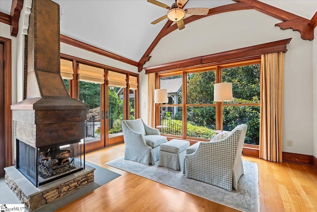 4 Huntington Ct, Greenville, SC 29615 - living room with lofted ceiling, wood finished floors, plenty of natural light, and a ceiling fan