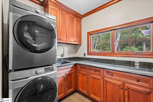 4 Huntington Ct, Greenville, SC 29615 - washroom featuring cabinet space, stacked washer / drying machine, healthy amount of natural light, crown molding, and light tile patterned flooring