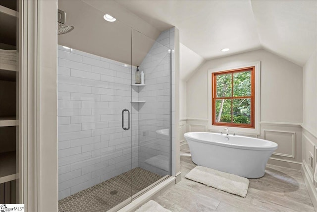 4 Huntington Ct, Greenville, SC 29615 - bathroom featuring a freestanding tub, a shower stall, vaulted ceiling, a decorative wall, and wainscoting