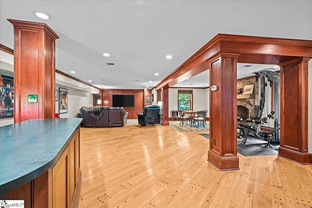 4 Huntington Ct, Greenville, SC 29615 - workout area featuring decorative columns, light wood-style floors, recessed lighting, and a fireplace