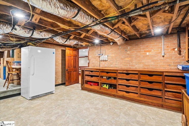 4 Huntington Ct, Greenville, SC 29615 - unfinished basement with freestanding refrigerator, a workshop area, and light flooring