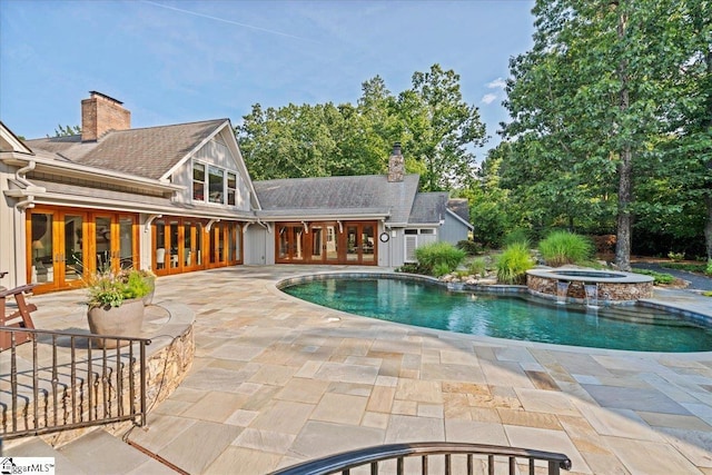 4 Huntington Ct, Greenville, SC 29615 - view of swimming pool with french doors, a patio area, and a pool with connected hot tub